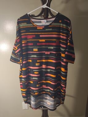 LuLaRoe Irma tunic top in a black multi-colored geometric pattern